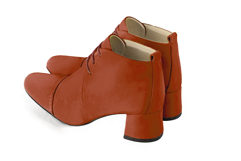 Terracotta orange women's ankle boots with laces at the front. Round toe. Low flare heels. Rear view - Florence KOOIJMAN